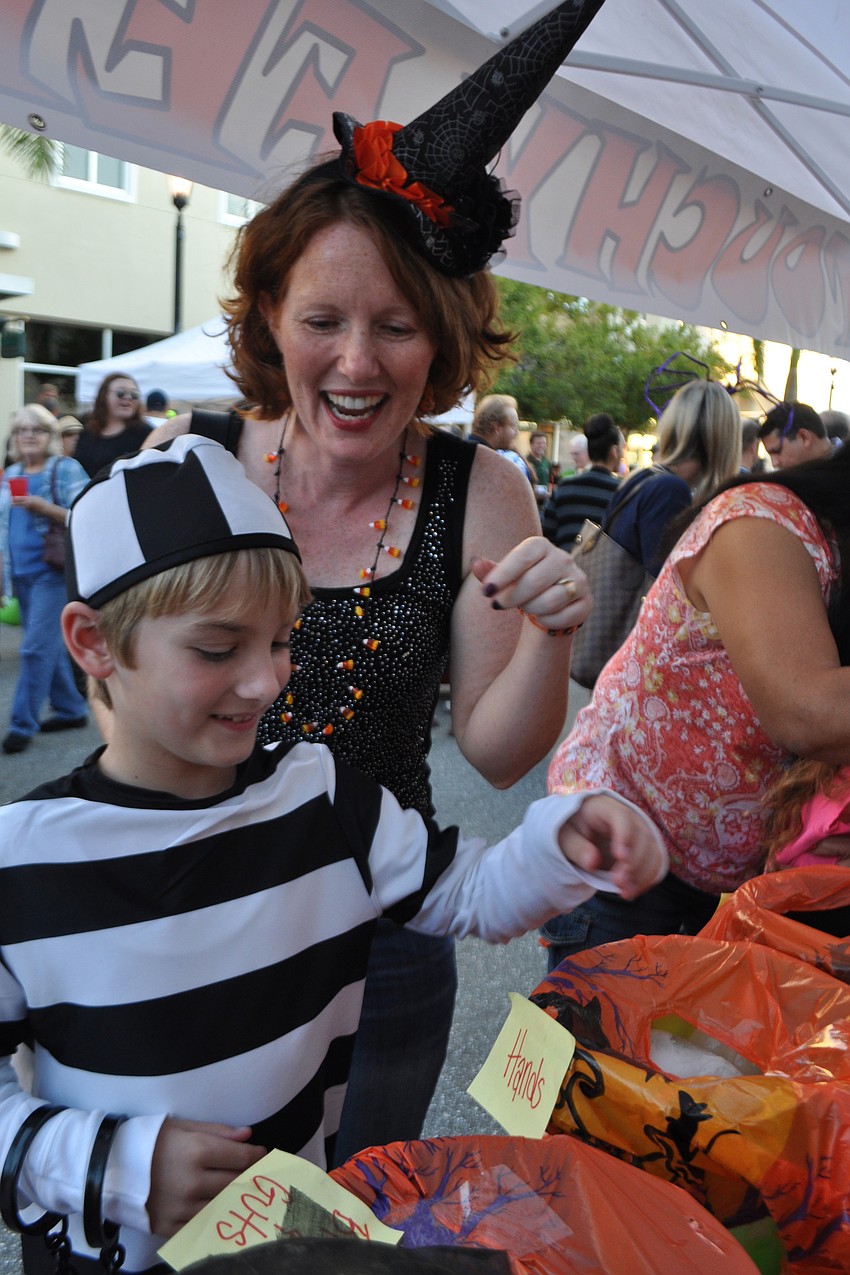 Noah Budzinsky, 8, and his aunt, Jen Kaiser, reached into boxes of unknown 