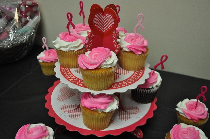 Pink-iced cupcakes are one of many party favors.