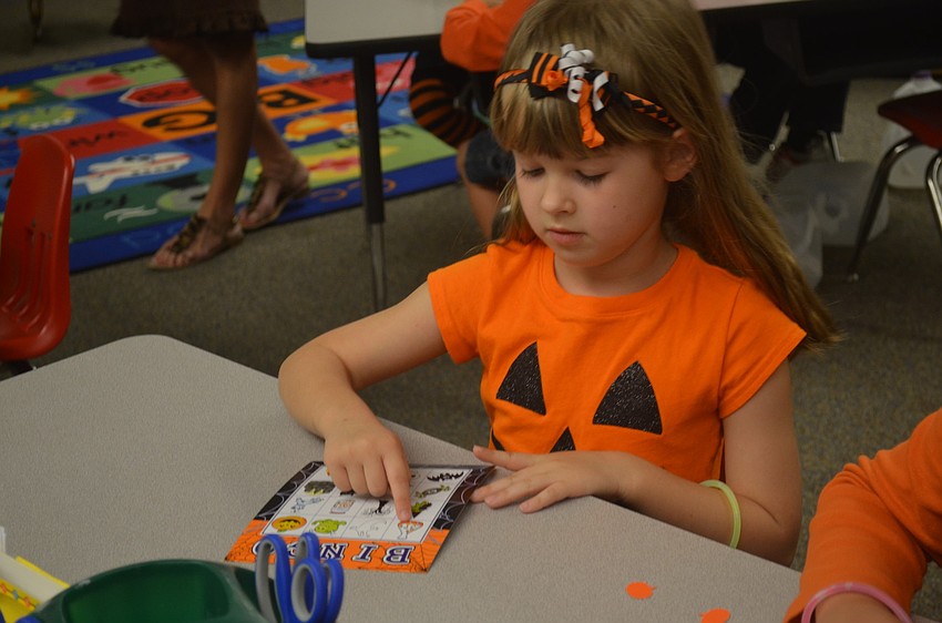 Lucy Sanborn prepares to play Halloween Bingo