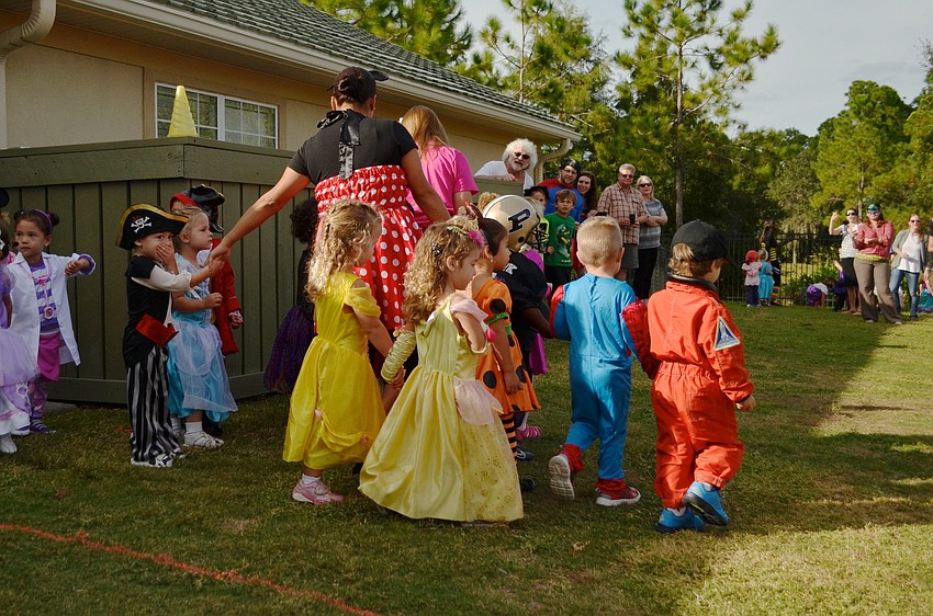 Teachers and students at Primrose School walk in the 9th annual Costume Parade.