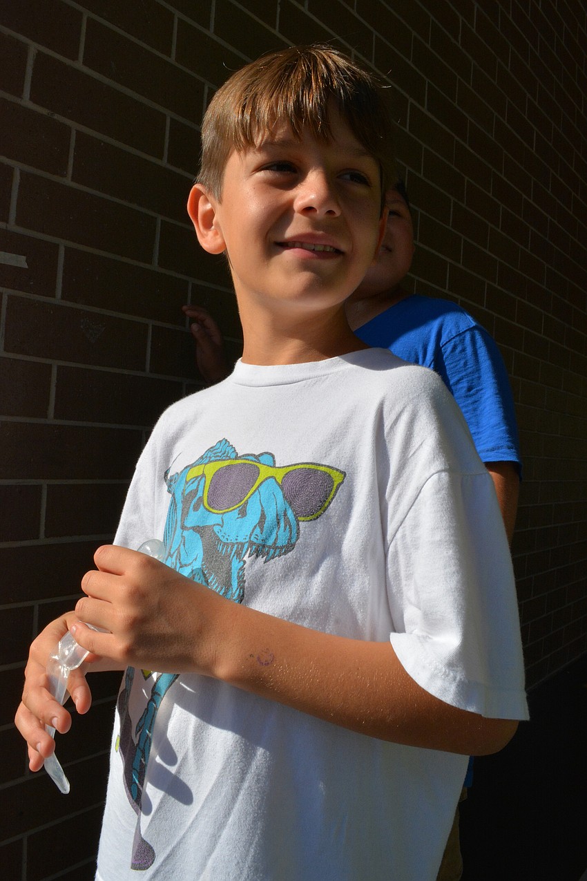 Julian Robothan cheered on friends, as they tried to land teachers in the dunk tank.