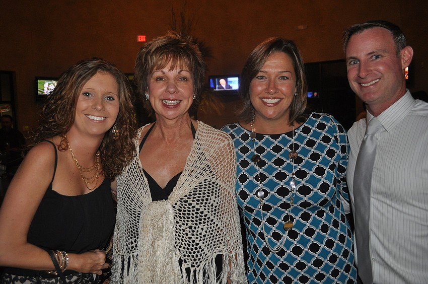 Sara Garger, McNeal Principal Norma Scott and Stacy and Mark Freeman