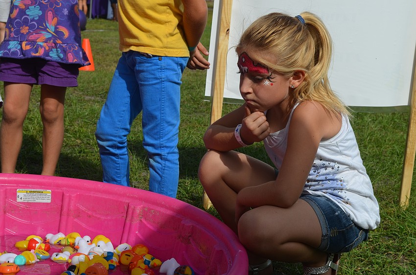 Charlotte Pico decides which rubber duck to choose.