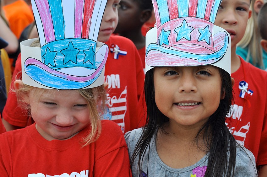 Kaitlyn Oâ€™Neal, 5, and Valaria Morales, 5, enjoy laughs together.