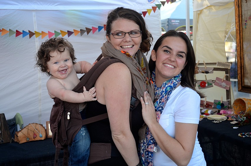 Titus Mimnagh, 7 months, and his mother Lyndsey, play around with Jessica Gunn.