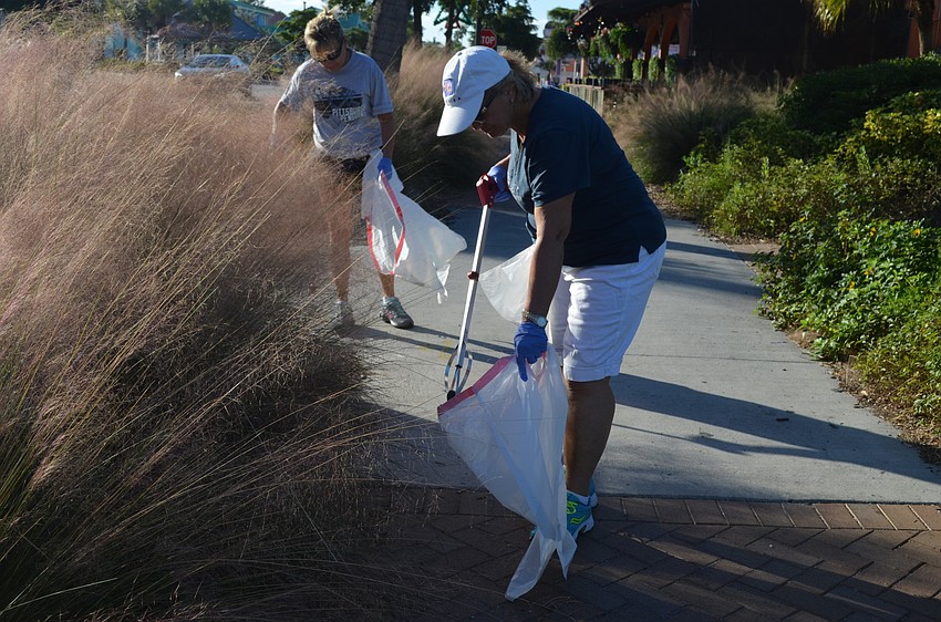 Carol Snider helped clean the village