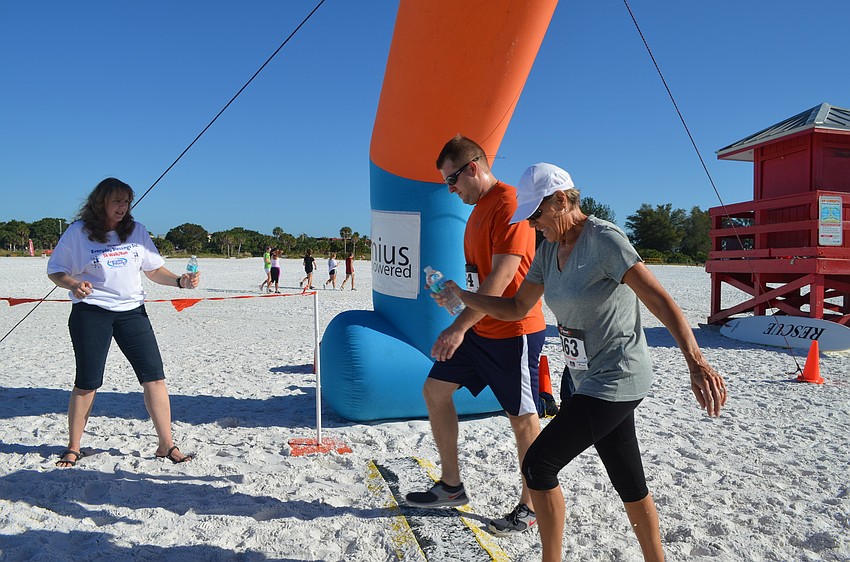 Ryan and Sue Powell cross the finish line