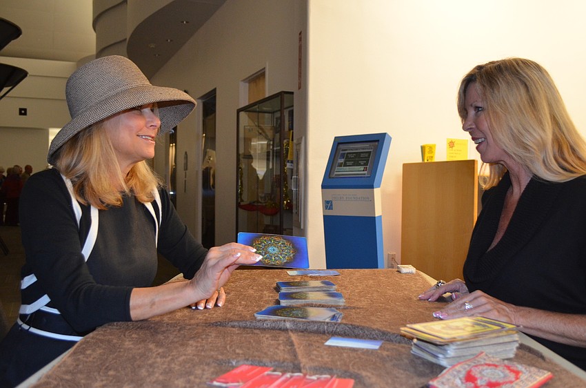 Jan Gaudreau has tarot cards read for her by Tere Greenwald.