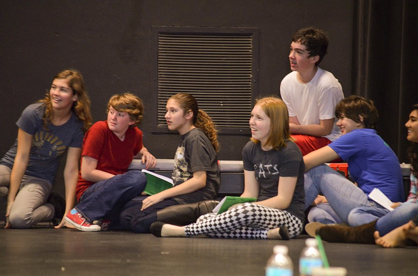 Students have fun on stage during rehearsal