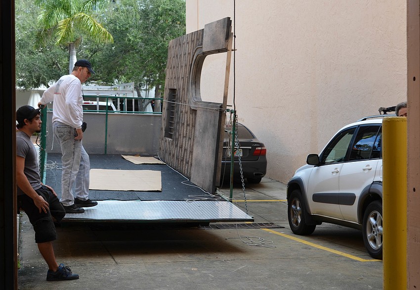 Johnny Welde and J-P Theron prepare to haul a set piece to the stage