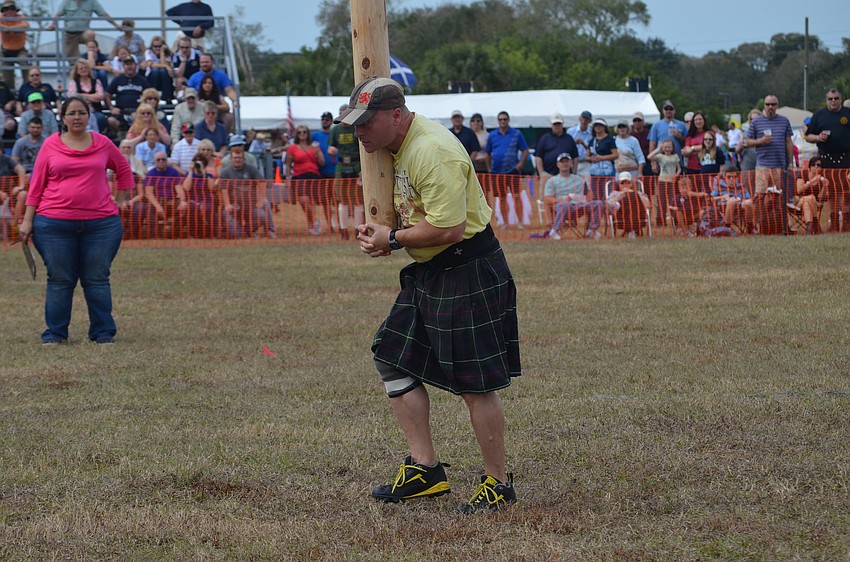 Mark Howe turns the first caber of the day.