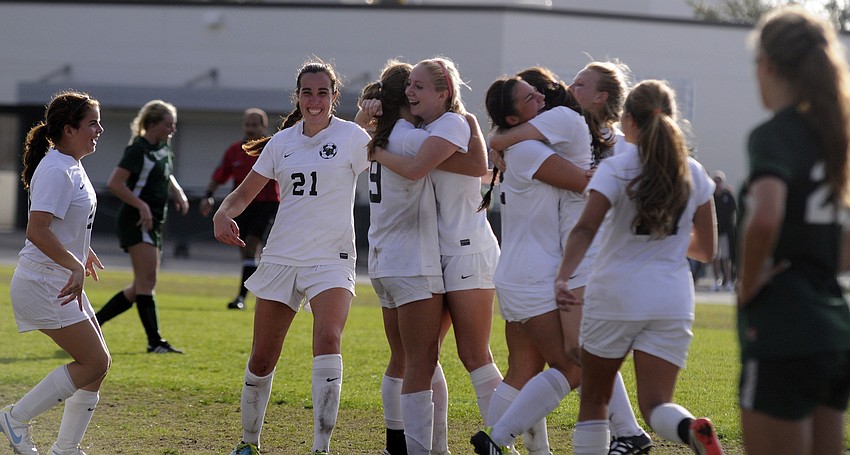 The Lakewood Ranch High girls soccer team celebrates following its 1-0 victory over Seminole in the Class 4A-Region 3 finals Feb. 1.