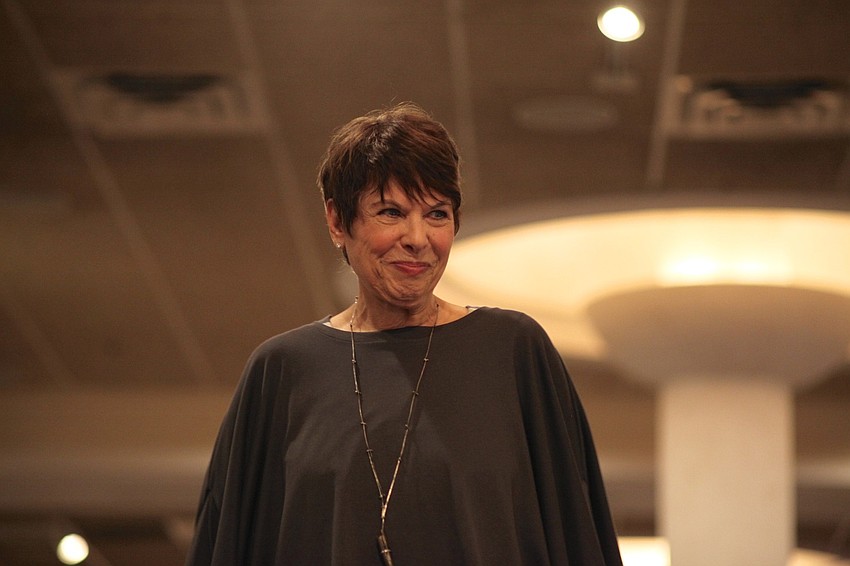Nancy Cohen smiles while modeling a Dream Weaver blouse.
