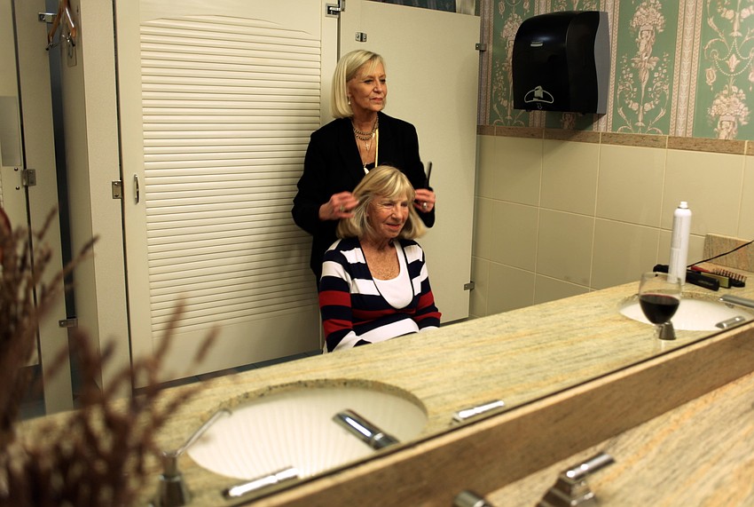 Sandy LaRose styles Kip Oâ€™Neilâ€™s hair before the fashion show.
