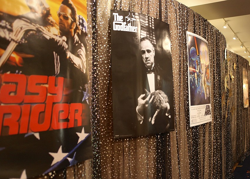 Posters of films favorites like â€œThe Godfatherâ€ and â€œEasy Riderâ€ adorn the walls.