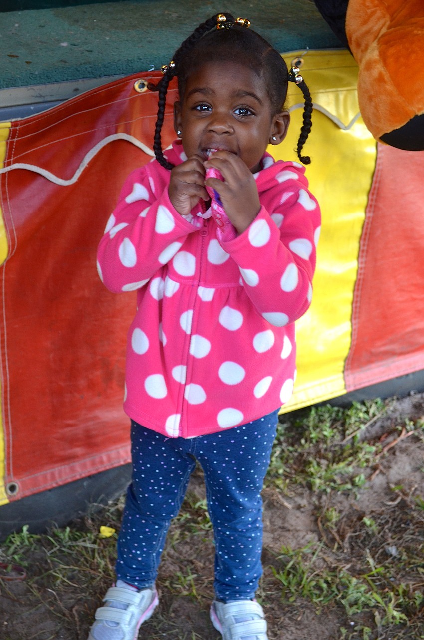 Myla Bryan, 2, kisses her new stuffed animal.