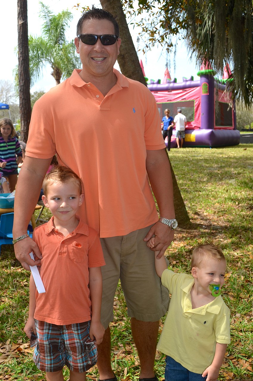 The Rhinesmith family â€” Tyler, 4, Justin, and Kaden, 2.