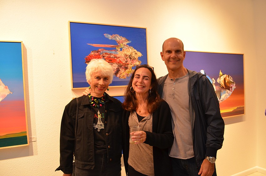 Pam Chew, Trulee Jameson and John Pirman in front of Hugh Davies work
