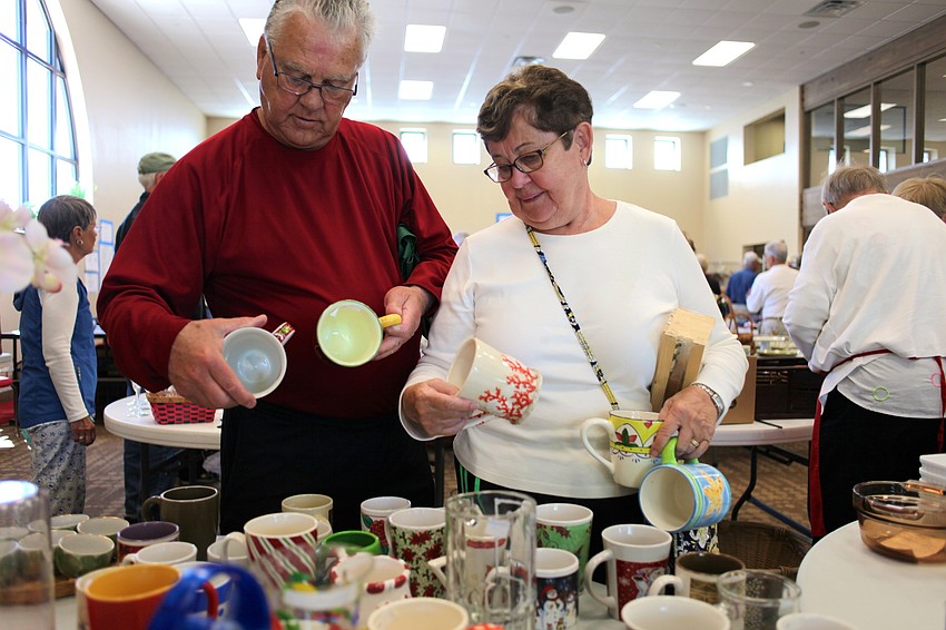Jack and Elaine Lawler pick a few mugs from the large selection.