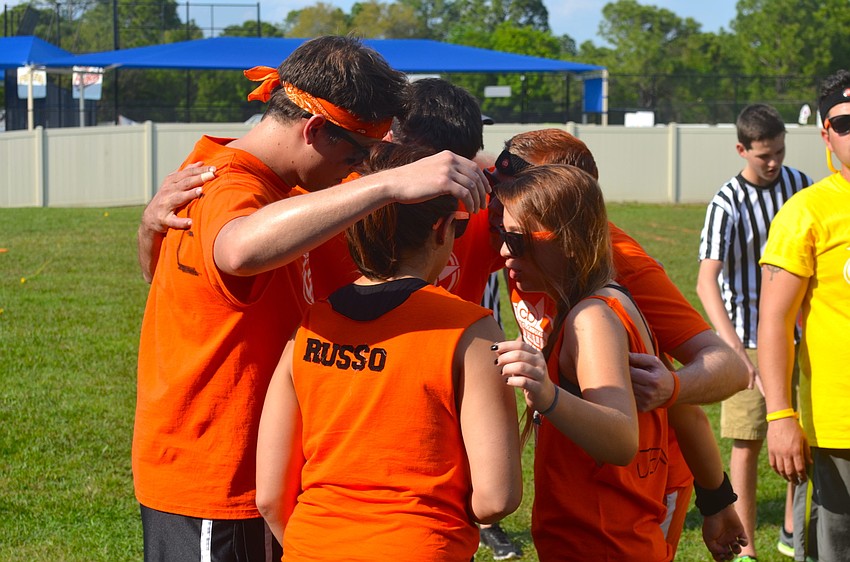 The orange team talks strategy.