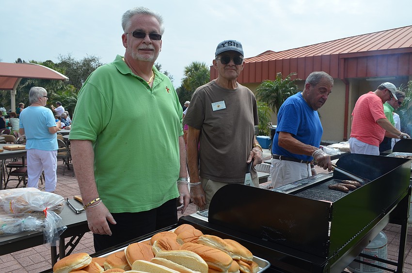 John Lauffer, Deacon Tom Grant and Tony Sacco make burgers.