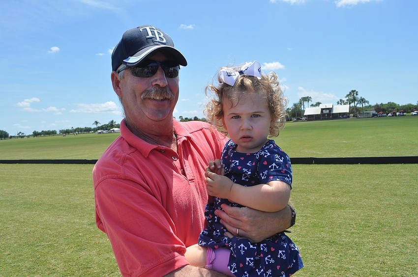 Bob Twinem and Cece Lyons, 1, attended the polo club for the first time.