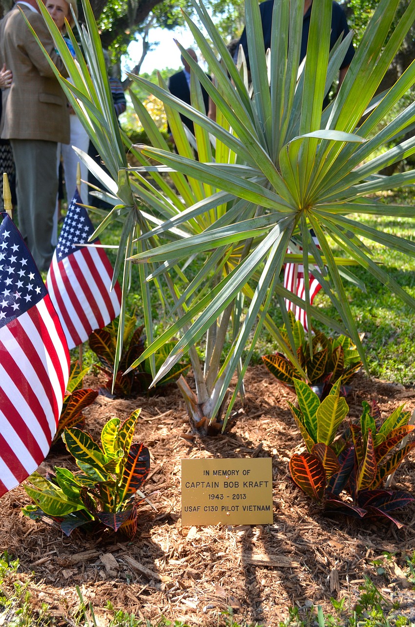 The plaque and palm are in front of the Longboat Library.