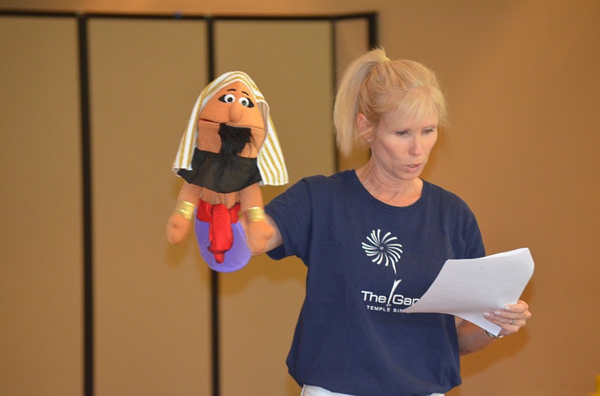 Director of Early Childhood Education Lara Freedman tells the story of Passover with puppets.