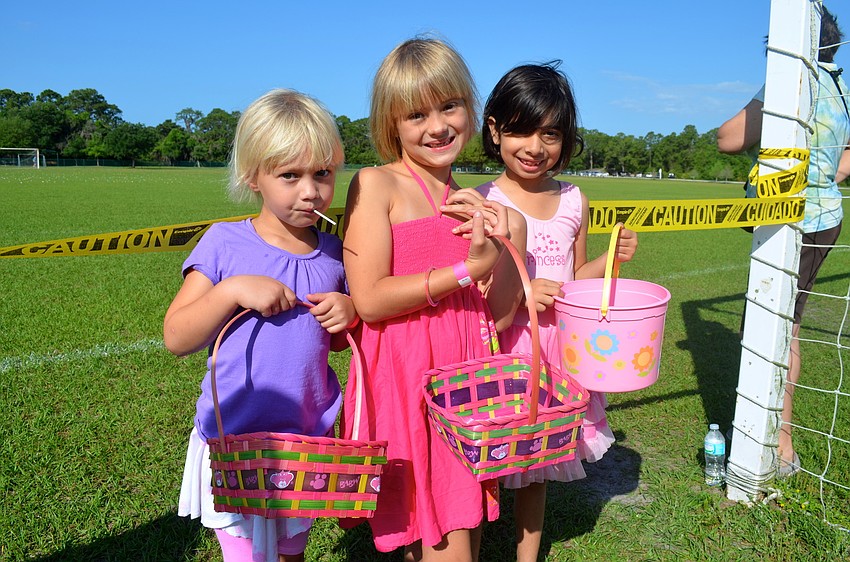 Addison and Berkeley Brown wait for the Easter egg hunt to start, with Panya Sethi.