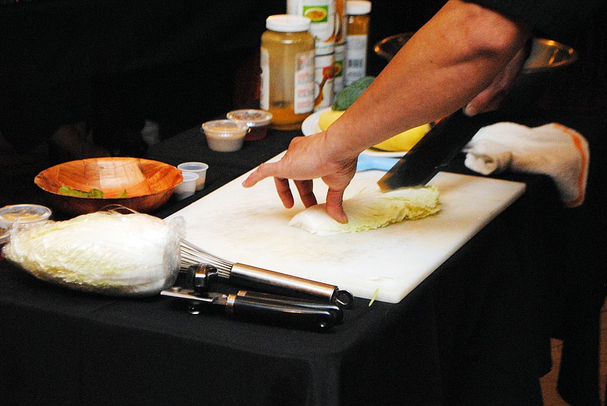 Chef Lam Lum demonstrates how to property cut lettuce.