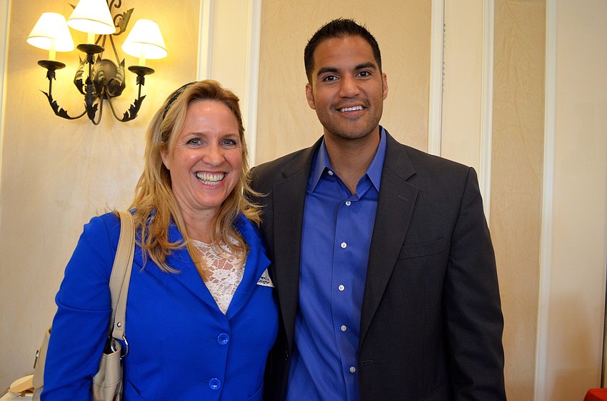 Lynne Bermel-Scripter compliments Jeremy Su'a on his presentation.