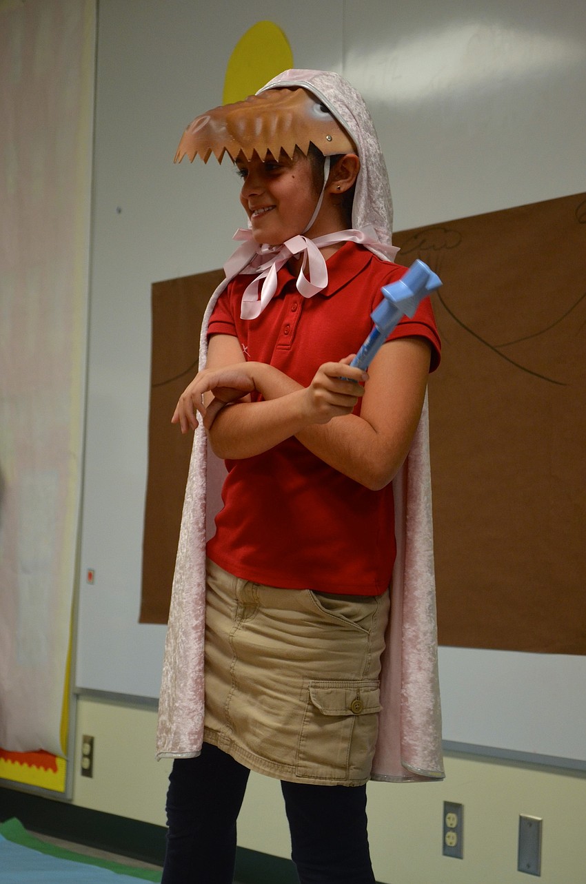 Kiana Foroughi flicks her wrist to use her magic wand.