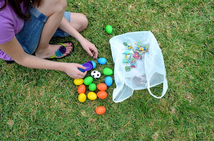 Kennedy Ames opens her Easter eggs to see what treats she found.