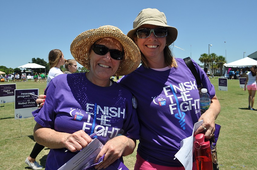 Katy Kimbrell and Nicole Gulsby judge team tent decorations.