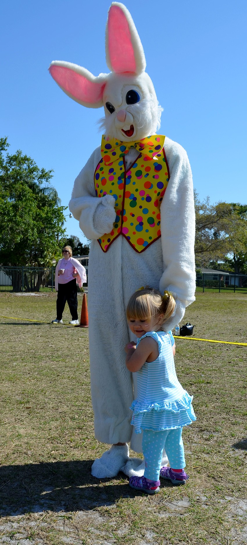 Olivia Peters hugs the Easter Bunny.