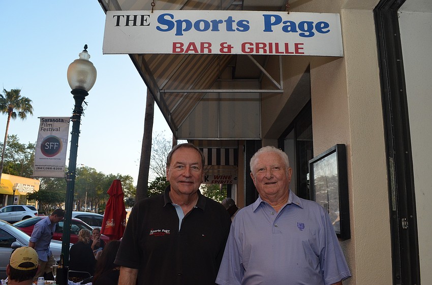 Partners Bob Richards and Kenny Barr opened Sports Page in 1995. They are looking into moving to a new location.