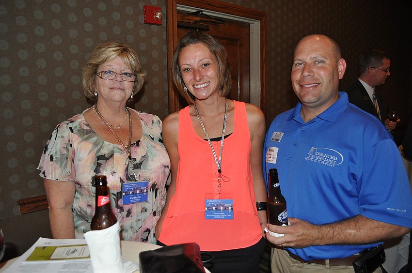 Pat Martin and Jenna Potter of Pampered Movers of Sarasota with Jerry Solomon of Advanced Technology