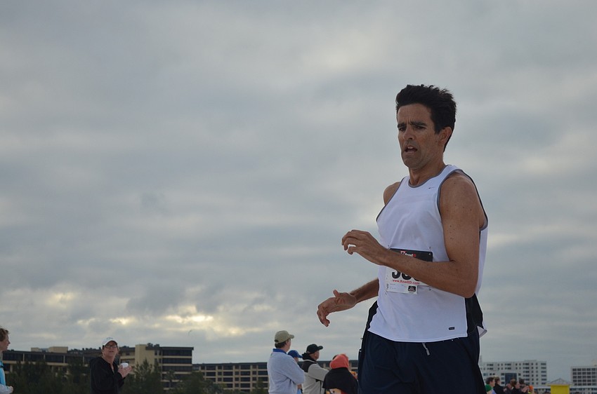 Damien Lane crosses the finish line with a time of 17:42.