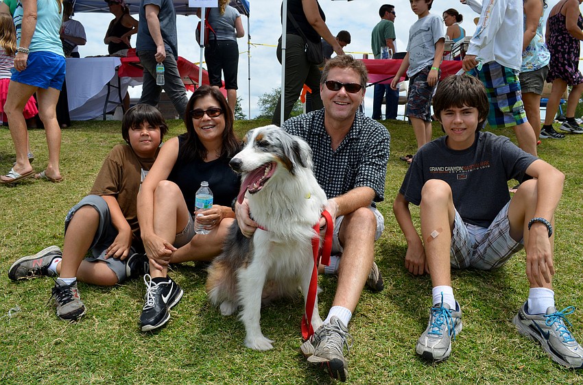 Angela and Jake Hartvigsen with their sons, Will and Ben and dog, Oz.