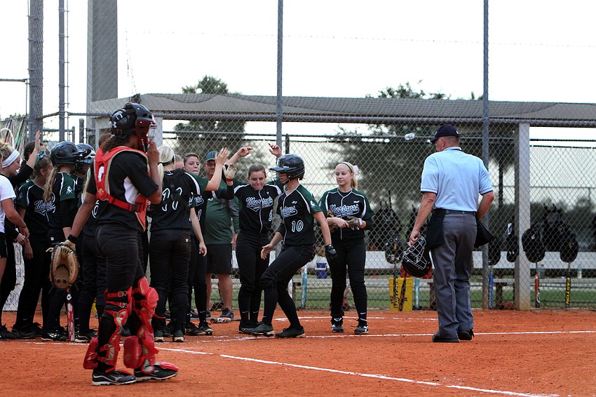 Lakewood Ranchâ€™s Taylor Newton, No. 10, was greeted at home plate after hitting a homerun.