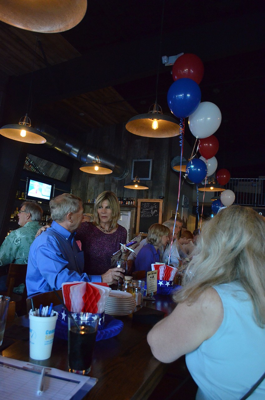 Mayor Suzanne Atwell mingles with supporters as she awaits the election results.
