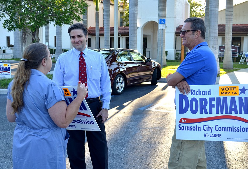 Richard Dorfman and supporter Valerie Dorr mingle with voters near the start of the day.