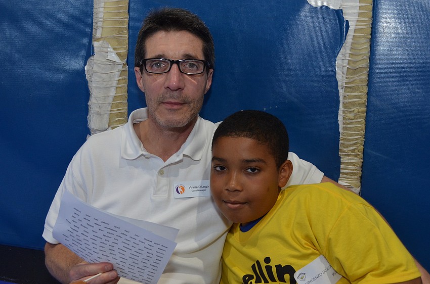 Vinnie DiLego prepares his son Bay Haven Elementary fourth grader Vincenzo for the spelling bee.