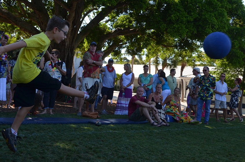 Sebastian E. sends the kickball flying in the air.