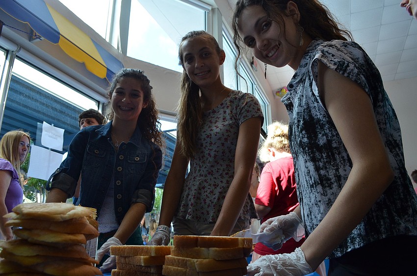 Ninth graders Jordan Glover, Regan Straeb and Samantha London make soy butter and jelly sandwiches.