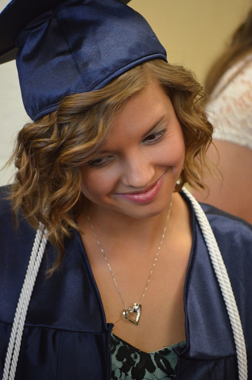 Melanie Mason chats with classmates before heading to cross the stage.