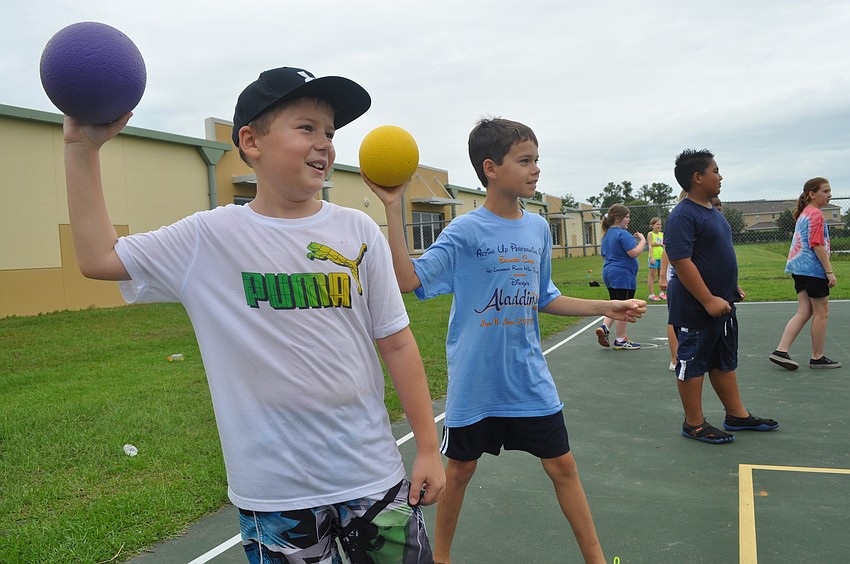 Forth-graders Evan Taylor and Caden Denslow sized up their targets in a game of dodgeball.