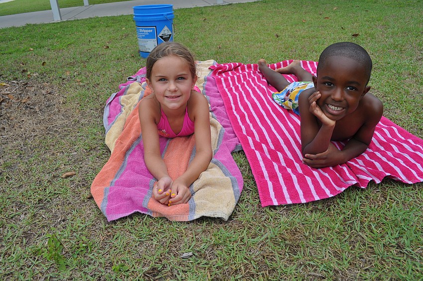 Kindergartners Brooke Sekula and Isaiah Carpenter sunbathed on a rainy day.