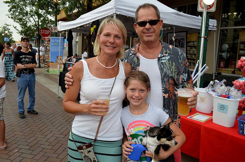 Susan and Bill Linville with their daughter, Addie, and dog, Radar.