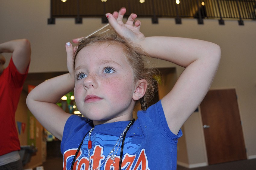 Meredith Beck touches her head, during a game of 